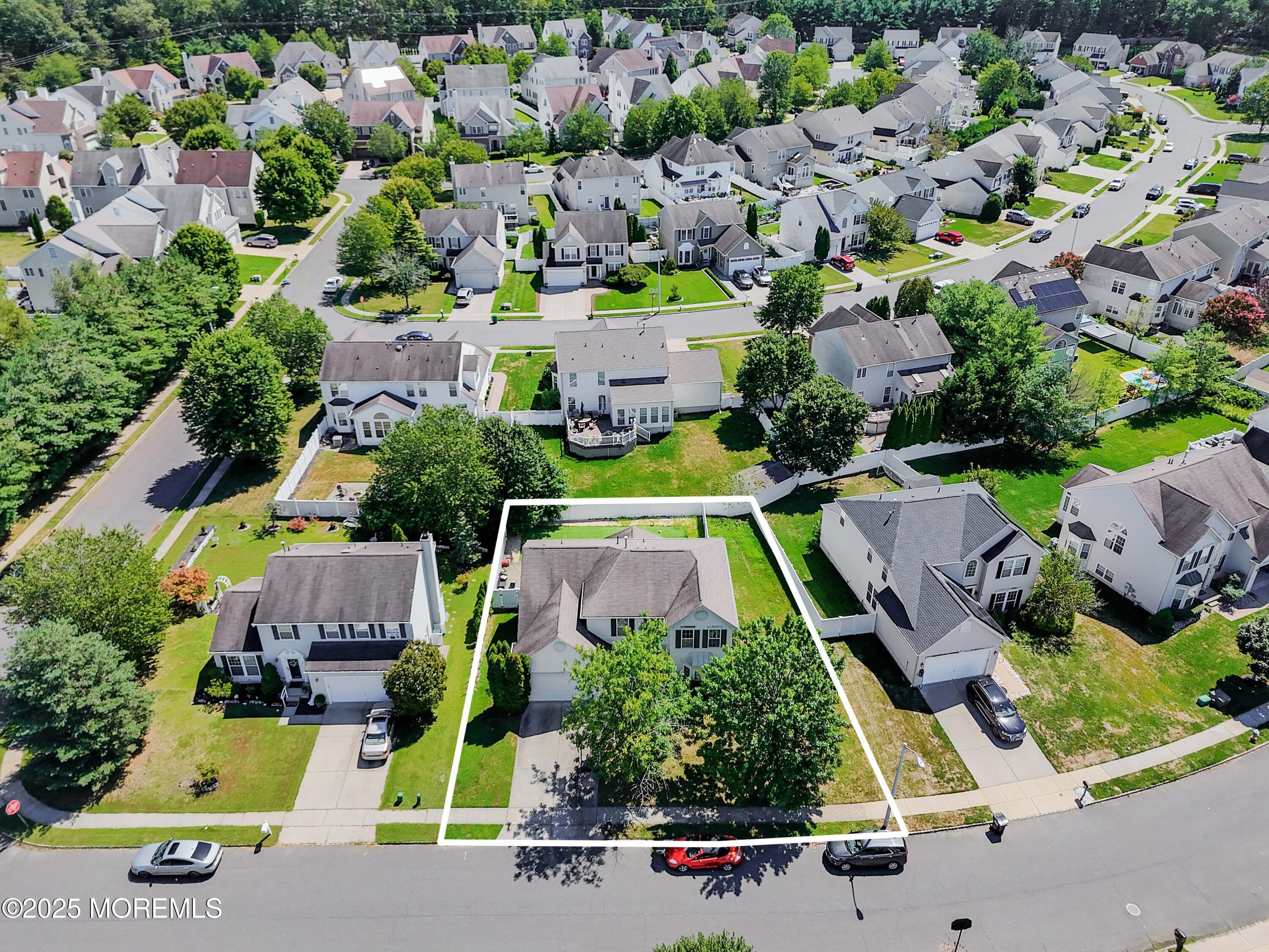 32 Firestone Drive Howell, NJ 07731 - Photo 32 of 43 an aerial view of a house with a swimming pool yard and outdoor seating