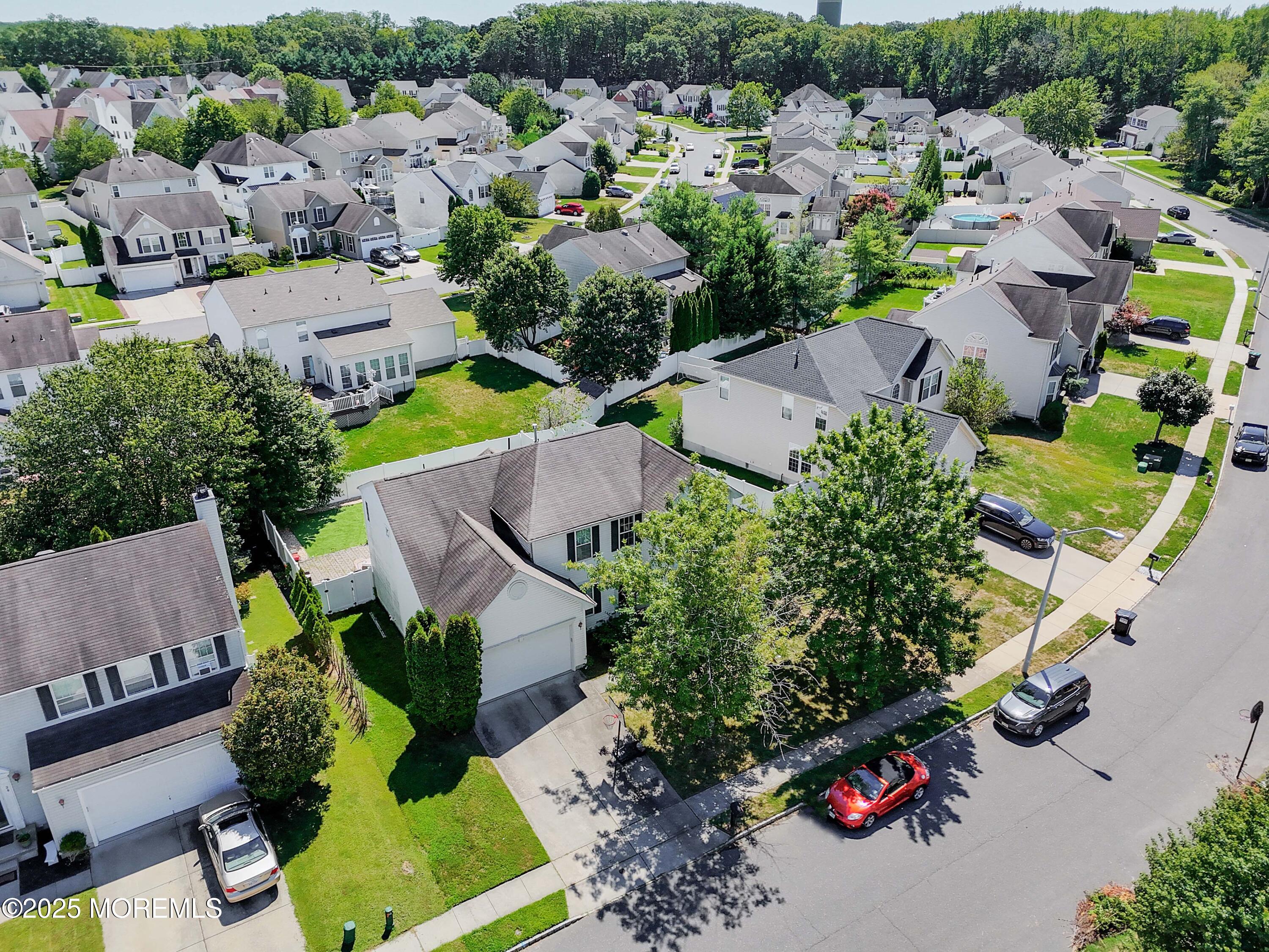 32 Firestone Drive Howell, NJ 07731 - Photo 33 of 43 an aerial view of multiple houses with yard