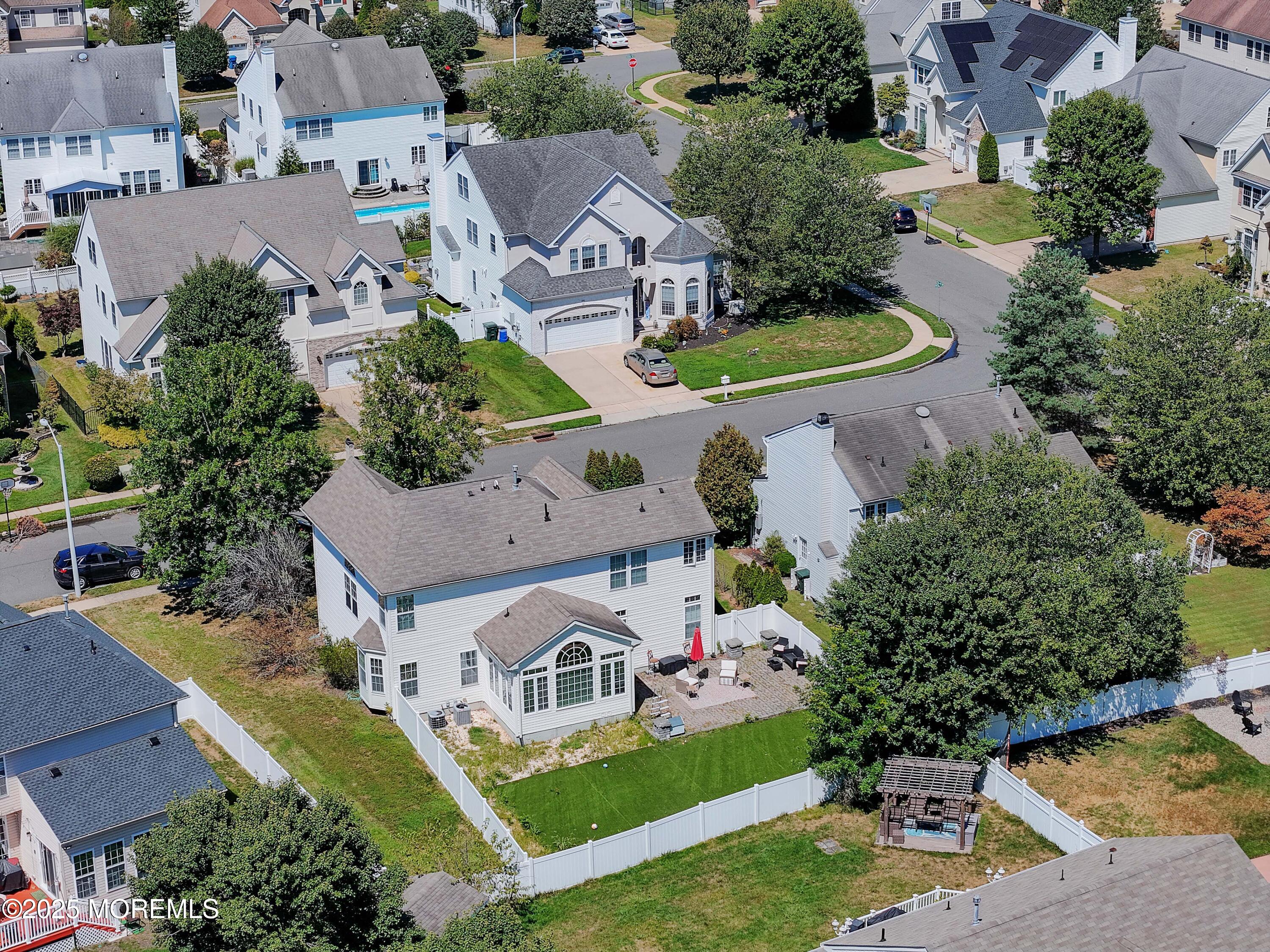 32 Firestone Drive Howell, NJ 07731 - Photo 35 of 43 an aerial view of multiple houses with yard