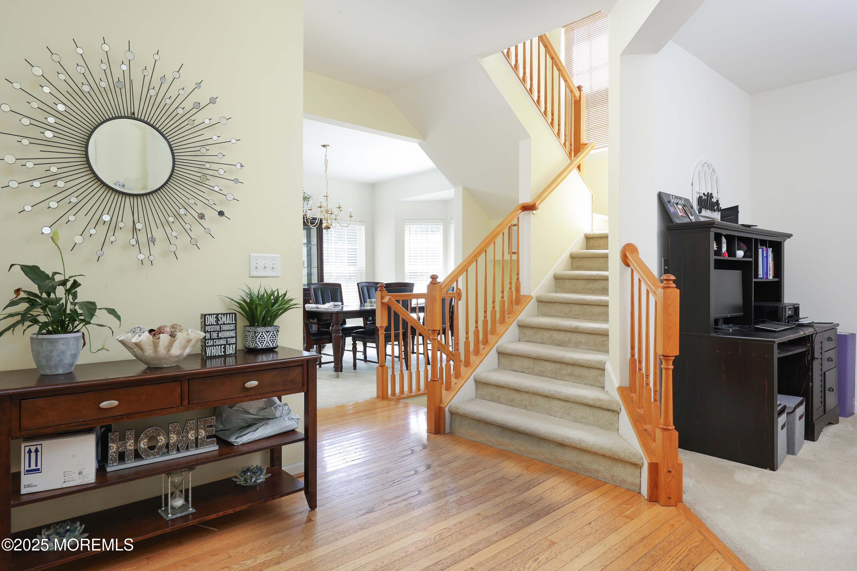 32 Firestone Drive Howell, NJ 07731 - Photo 5 of 43 a view of a hallway with wooden floor and staircase