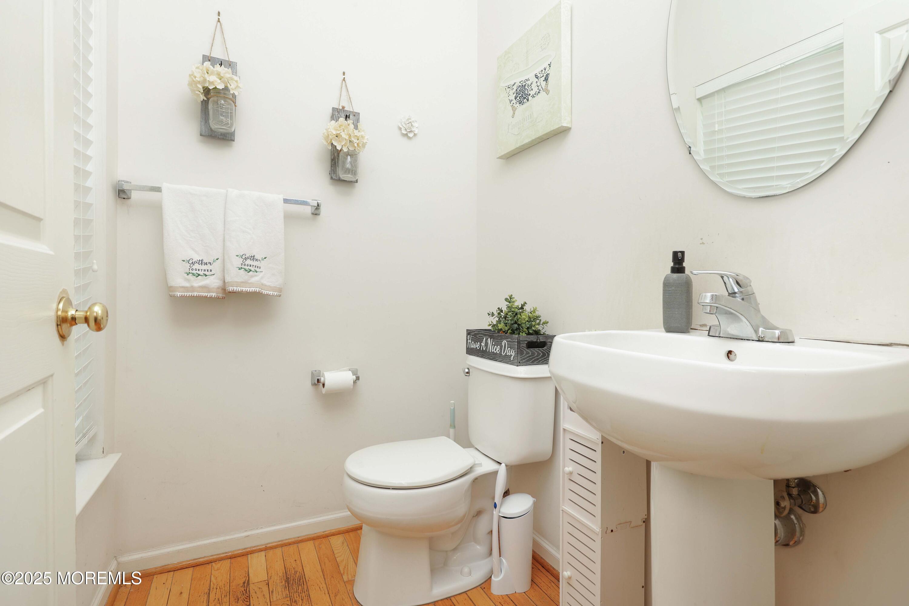 32 Firestone Drive Howell, NJ 07731 - Photo 8 of 43 a bathroom with a sink mirror and toilet
