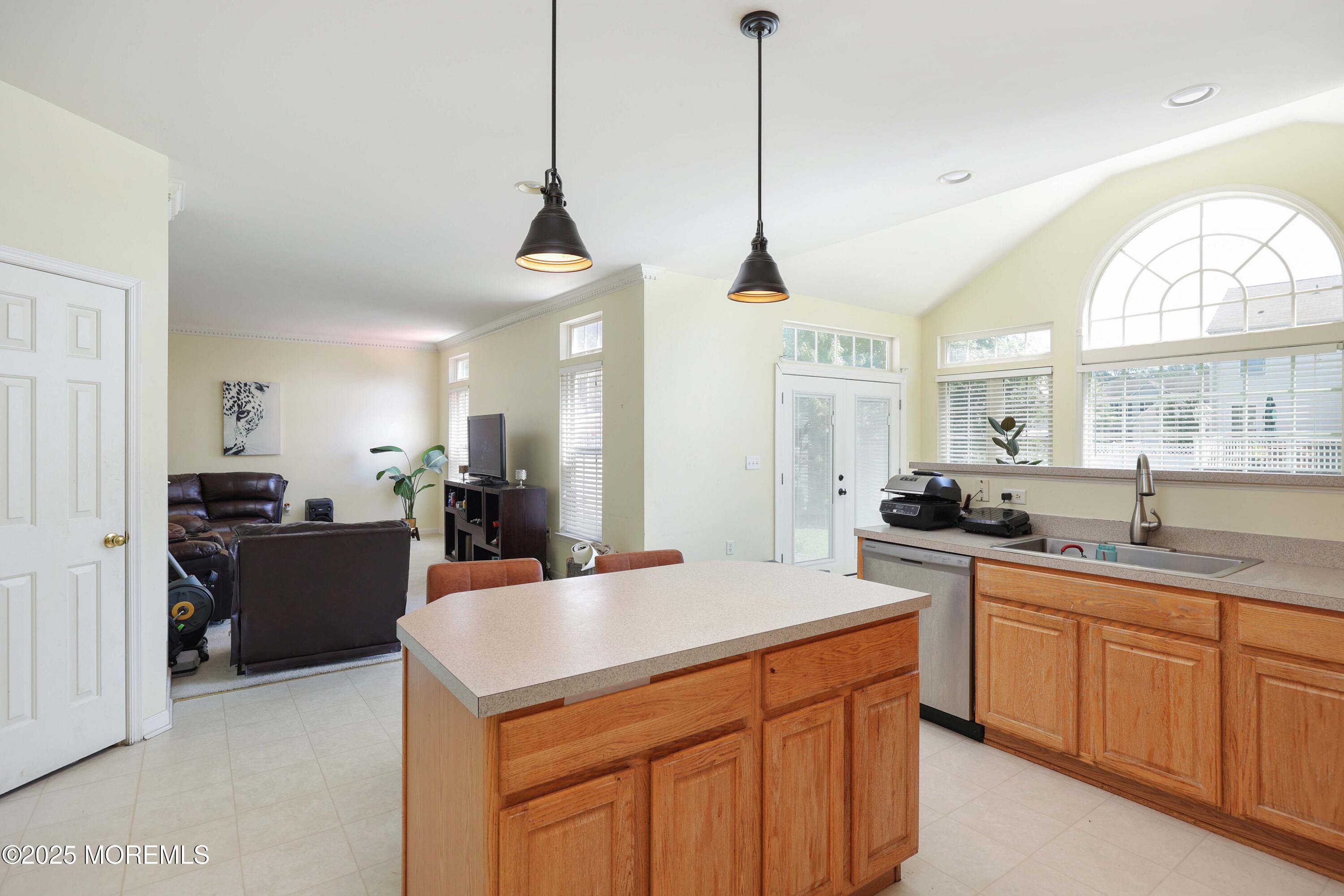 32 Firestone Drive Howell, NJ 07731 - Photo 10 of 43 a kitchen with a stove a sink a center island and windows