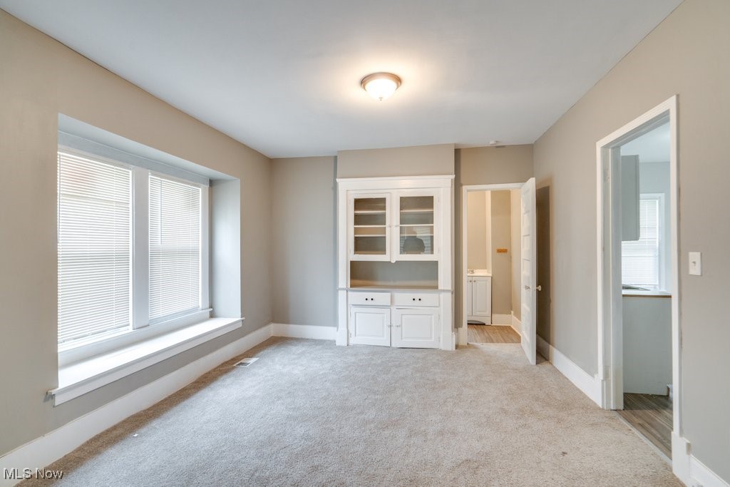 1261 Rozelle Avenue Cleveland, OH 44112 - Photo 9 of 32 Unfurnished bedroom featuring light carpet