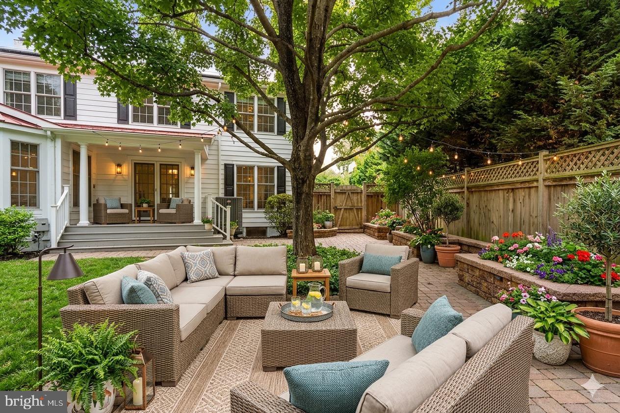 4007 West Braddock Road Alexandria, VA 22304 - Photo 38 of 52 a view of a patio with couches table and chairs potted plants and large tree