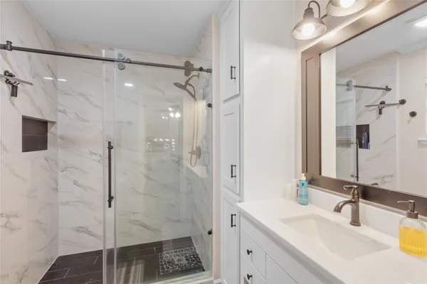 a bathroom with a sink and a mirror