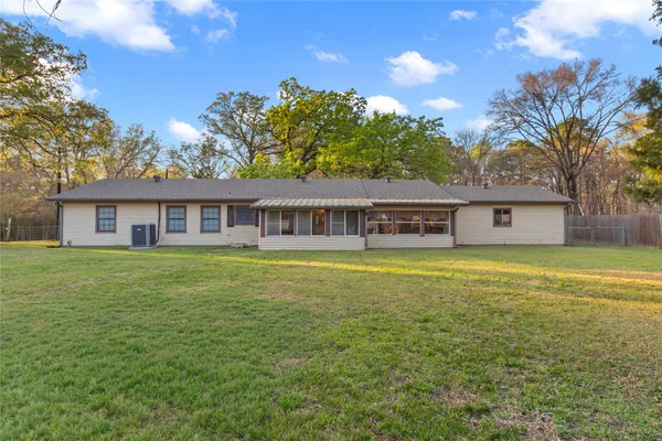 a front view of house with yard and seating area