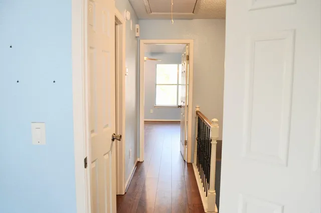 a view of a bathroom from a hallway