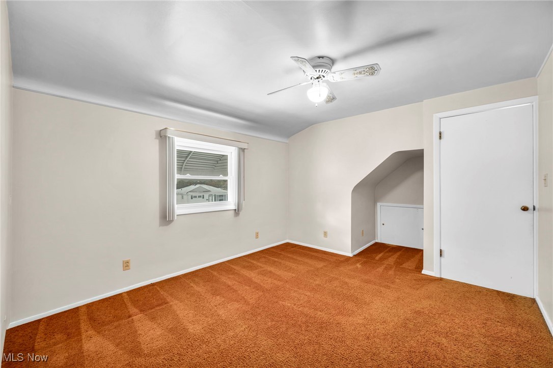1711 Rush Road Wickliffe, OH 44092 - Photo 19 of 38 Bonus room with carpet flooring, ceiling fan, and lofted ceiling