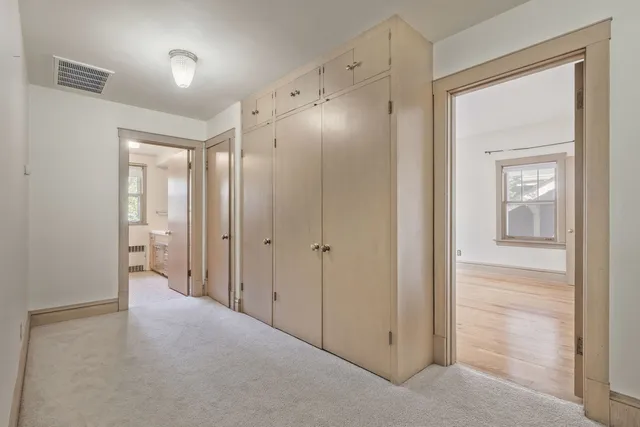 a bathroom with a glass door shower