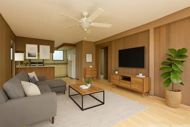 a living room with furniture and a flat screen tv