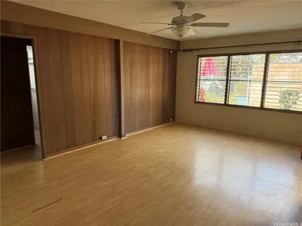 an empty room with windows and entrance