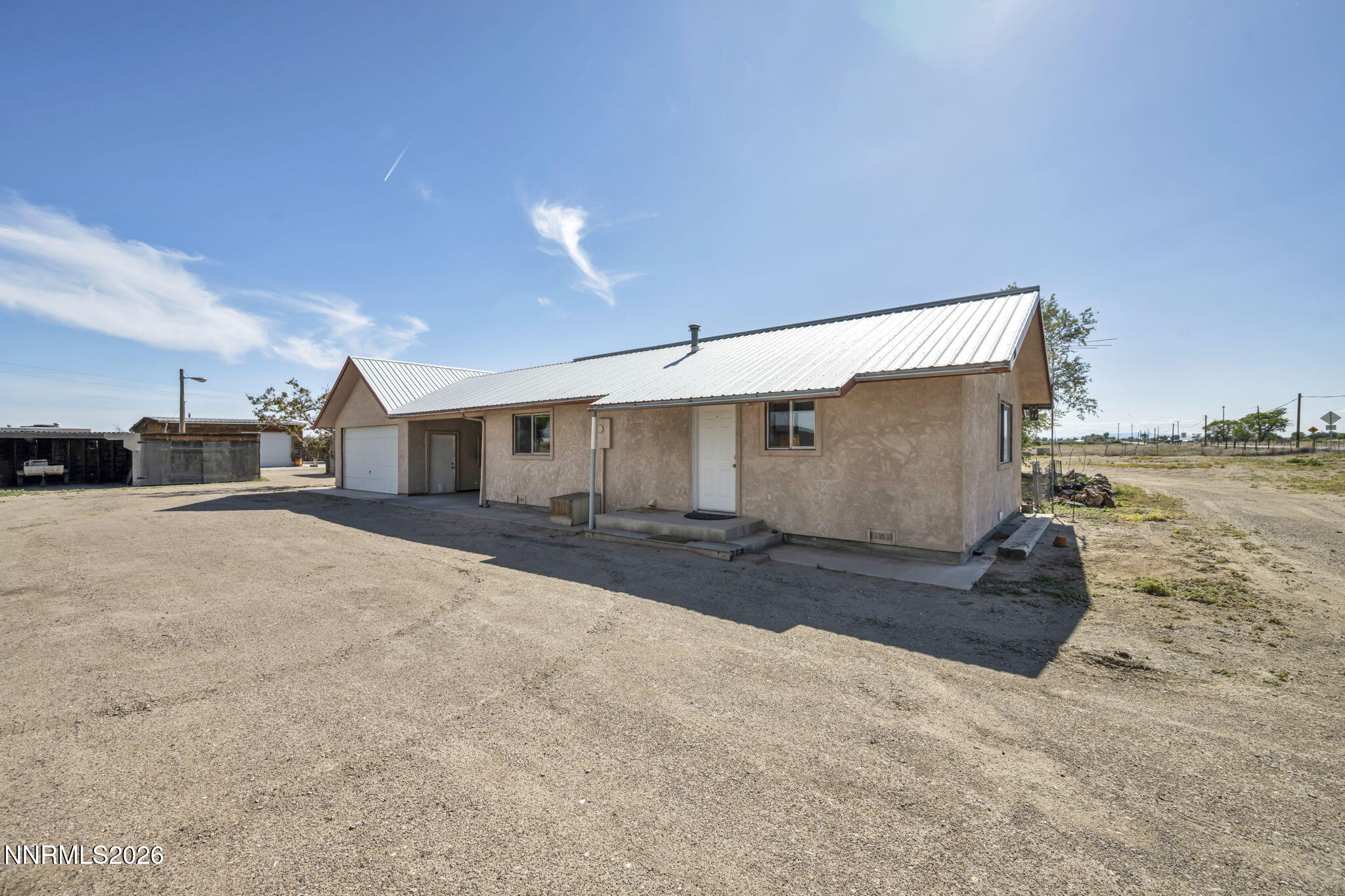 5250 Stillwater Road Fallon, NV 89406 - Photo 2 of 53 a view of a house with a yard