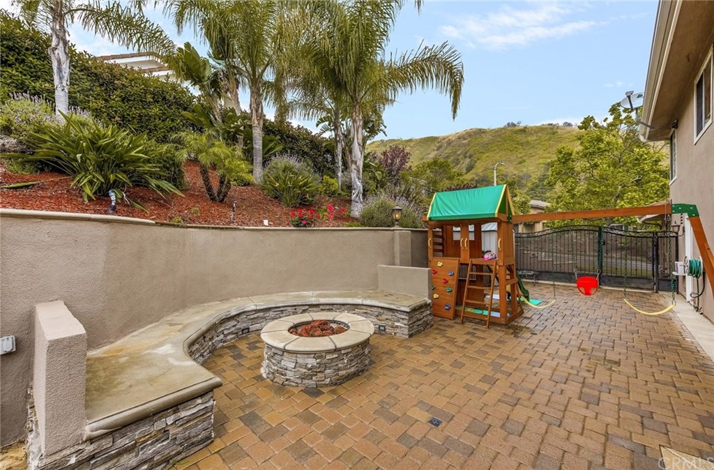 4224 San Ramon Drive Corona, CA 92882 - Photo 15 of 43 Large gated side yard. Firepit with seating. Great RV possibilities.