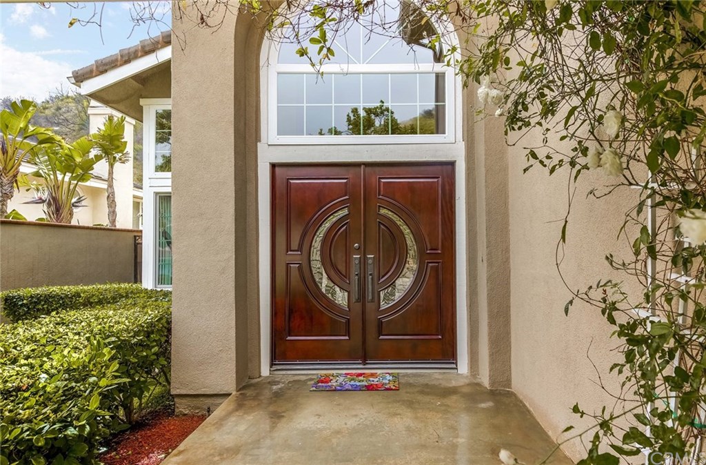 4224 San Ramon Drive Corona, CA 92882 - Photo 17 of 43 Grand Custom Mahogany Doors. Newer Dual Paned Windows.