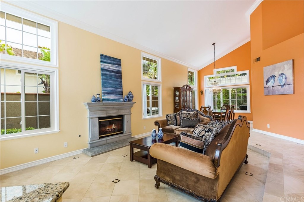 4224 San Ramon Drive Corona, CA 92882 - Photo 19 of 43 Formal Living Room with cozy fireplace and spacious Formal Dining Room. Soaring Cathedral Ceilings.