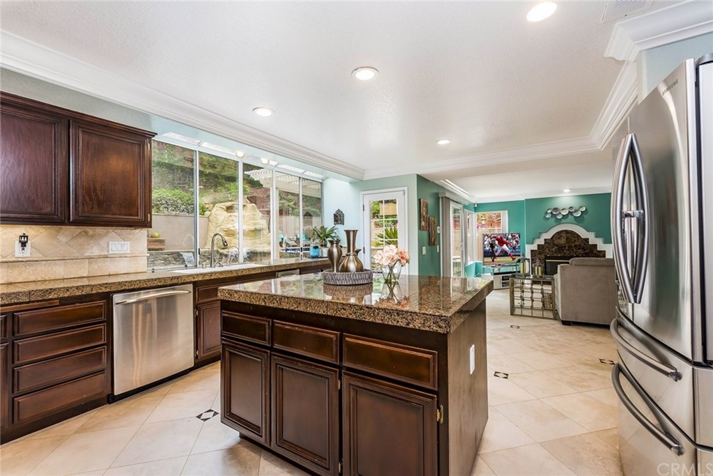 4224 San Ramon Drive Corona, CA 92882 - Photo 25 of 43 Family Room flows off Kitchen. Multiple views to your backyard oasis.