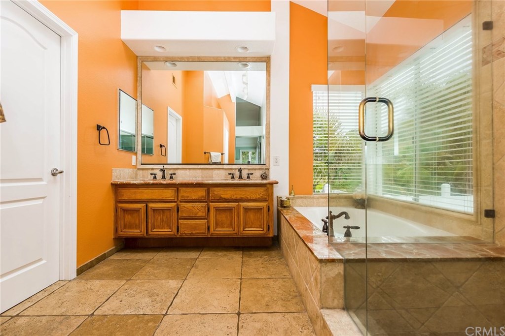 4224 San Ramon Drive Corona, CA 92882 - Photo 31 of 43 Upgraded Master Bath with travertine and marble. Dual sinks, large tub and walk in shower. 2 walk-in closets.