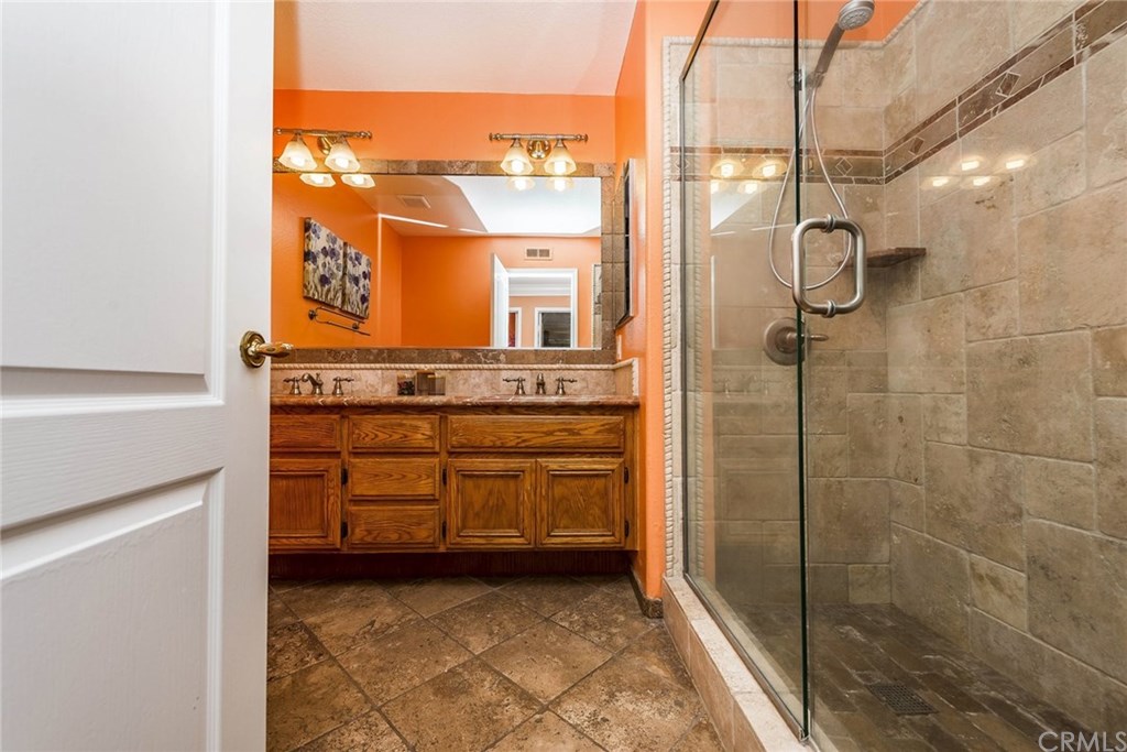 4224 San Ramon Drive Corona, CA 92882 - Photo 35 of 43 Upstairs secondary bath with custom stone upgrades. Dual sinks.