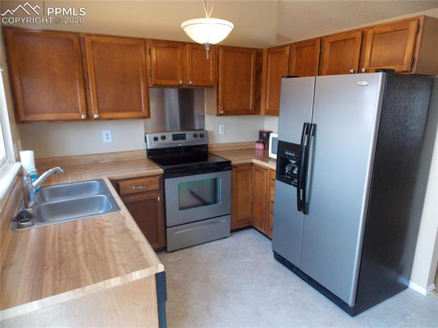 6375 Bismark Road Colorado Springs, CO 80922 - Photo 8 of 24 Yes, the refrigerator is included.