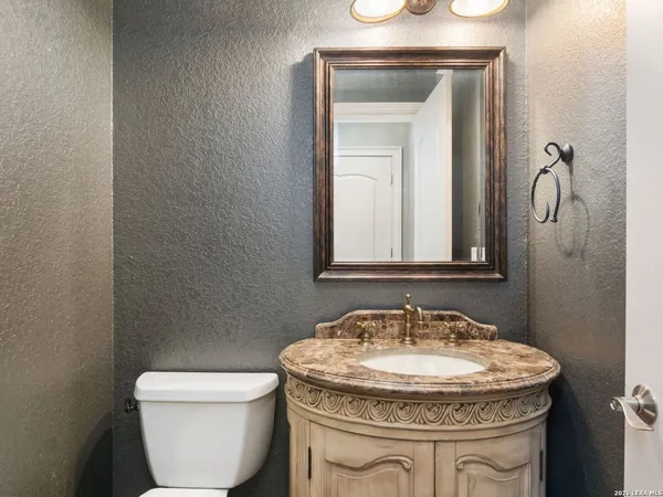 a bathroom with a toilet and a sink