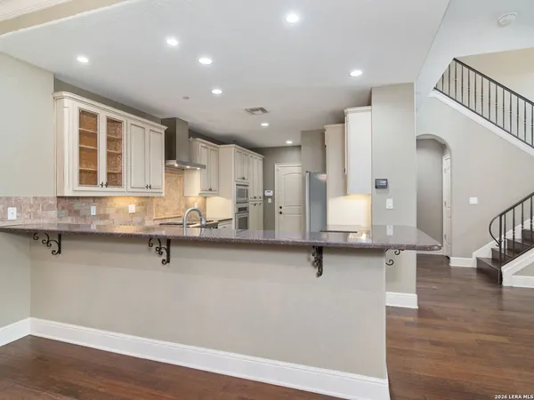 a view of kitchen and wooden floor
