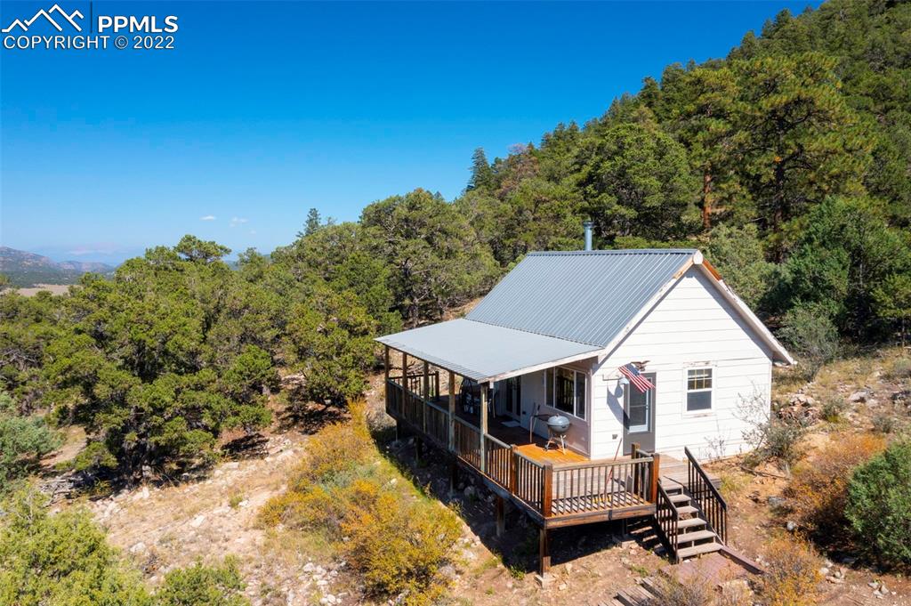 2126 E Path Cotopaxi, CO 81223 - Photo 34 of 34 a view of a house with a bed and wooden fence