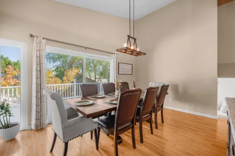 a view of a dining room with furniture window and wooden floor