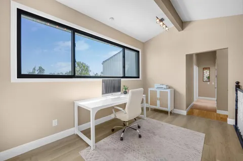 a workspace with furniture and window