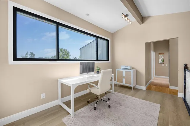 a workspace with furniture and window