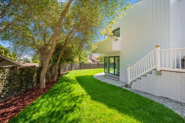 a view of balcony with two and trees