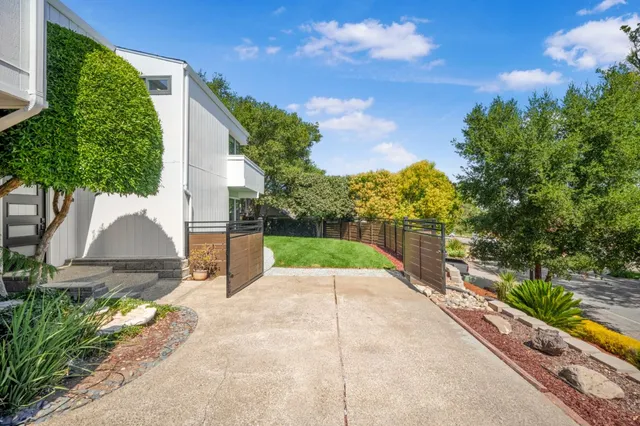 an aerial view of a house with a yard