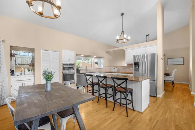 a view of a dining room with furniture and wooden floor