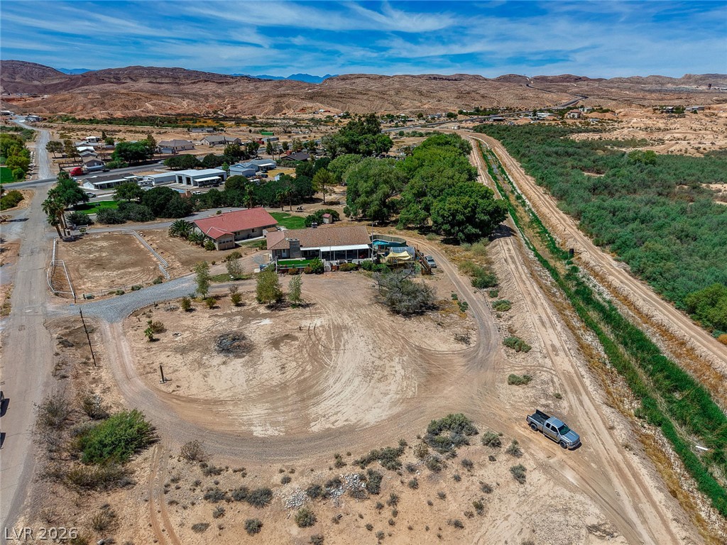 1920 Bowman Road Logandale, NV 89021 - Photo 66 of 68 Expansive desert acreage frames this private estate bordered by natural greenery and rugged mountain views.