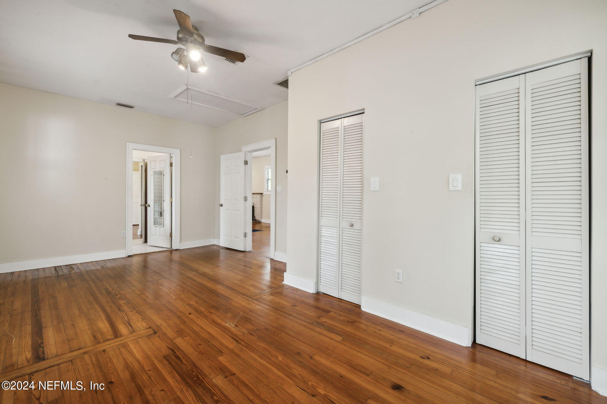 2887 Forbes Street Jacksonville, FL 32205 - Photo 16 of 35 a view of empty room with wooden floor and ceiling fan