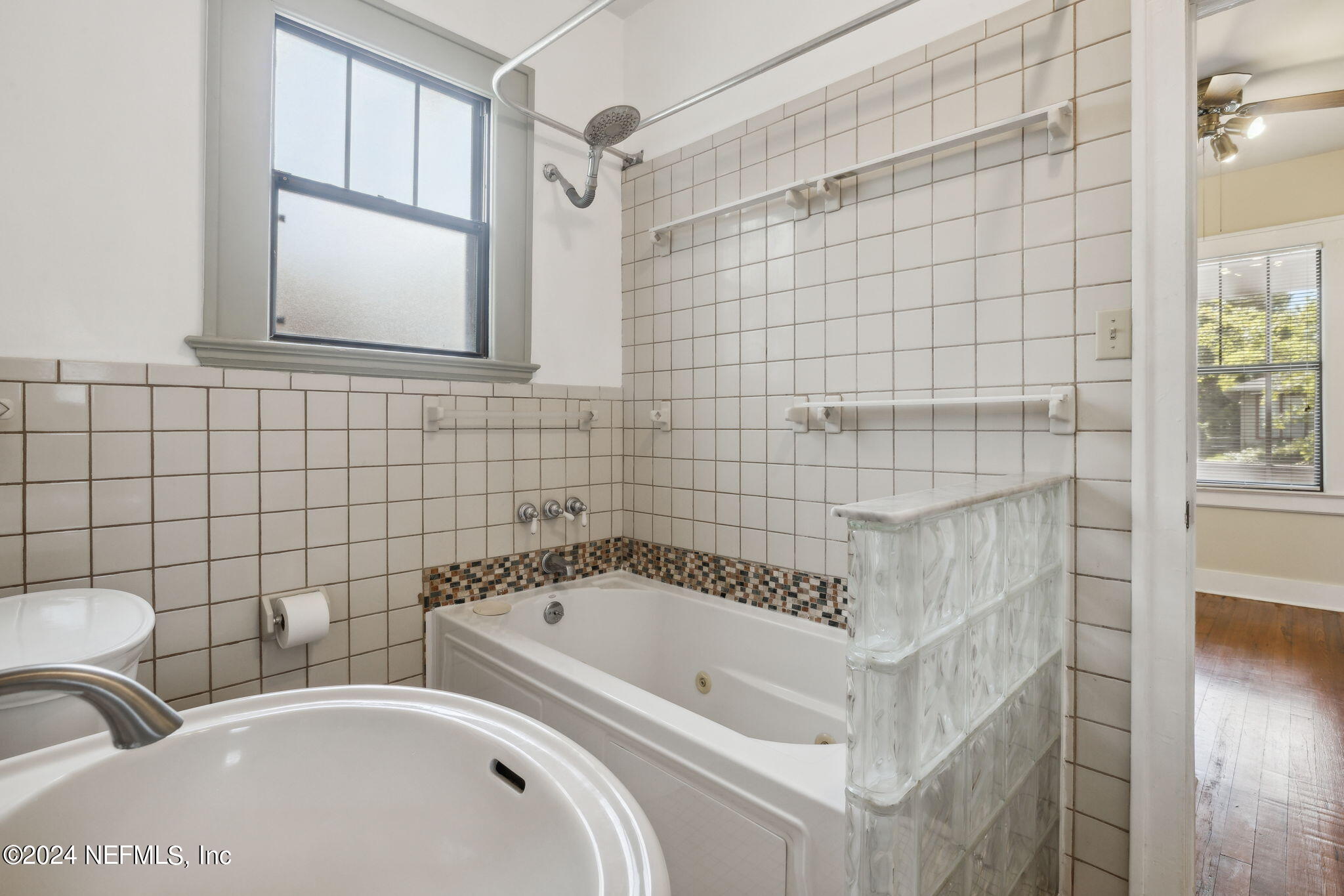 2887 Forbes Street Jacksonville, FL 32205 - Photo 20 of 35 a bathroom with a bathtub and a shower