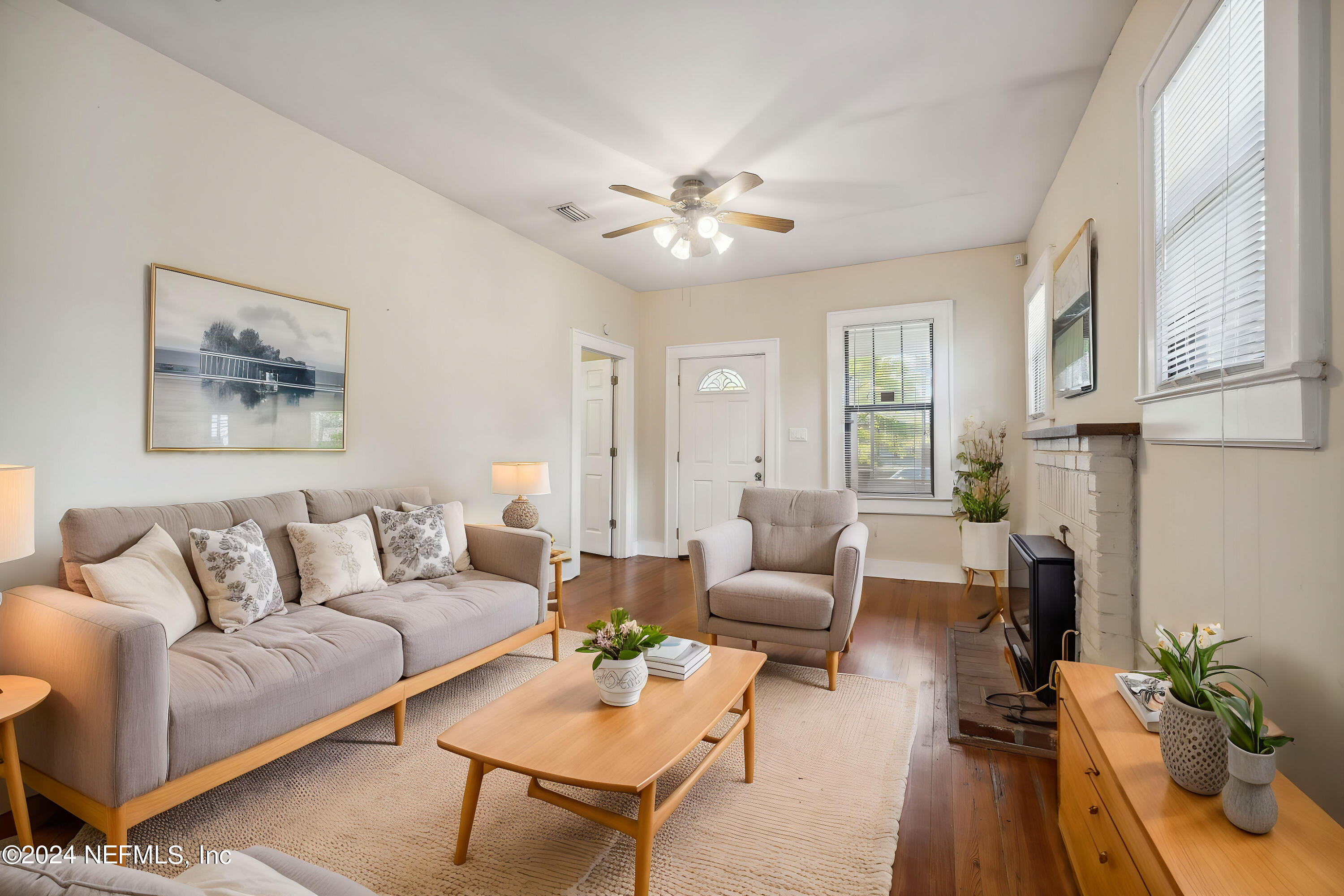 2887 Forbes Street Jacksonville, FL 32205 - Photo 5 of 35 a living room with furniture and a chandelier