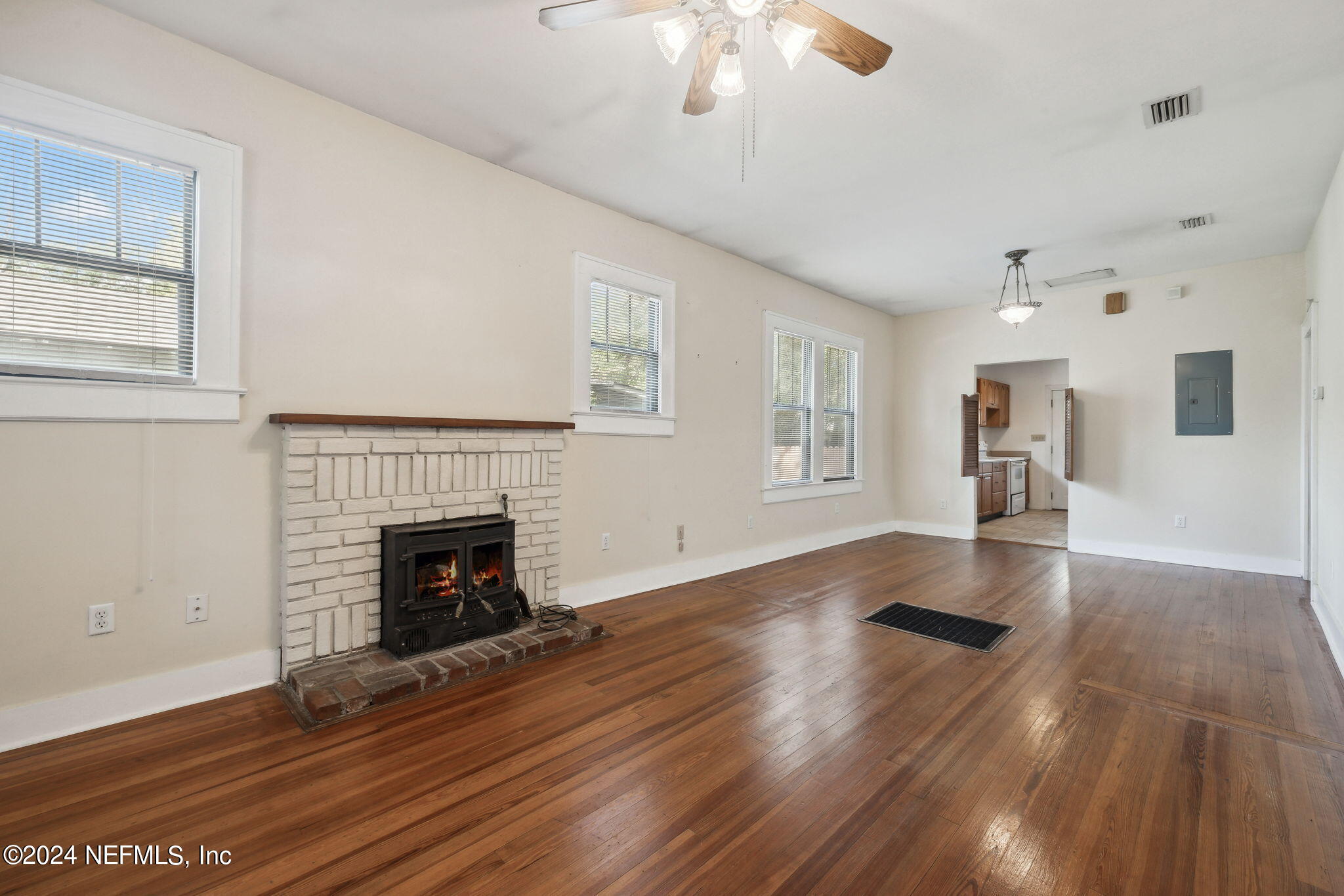 2887 Forbes Street Jacksonville, FL 32205 - Photo 8 of 35 a view of empty room with wooden floor and fireplace