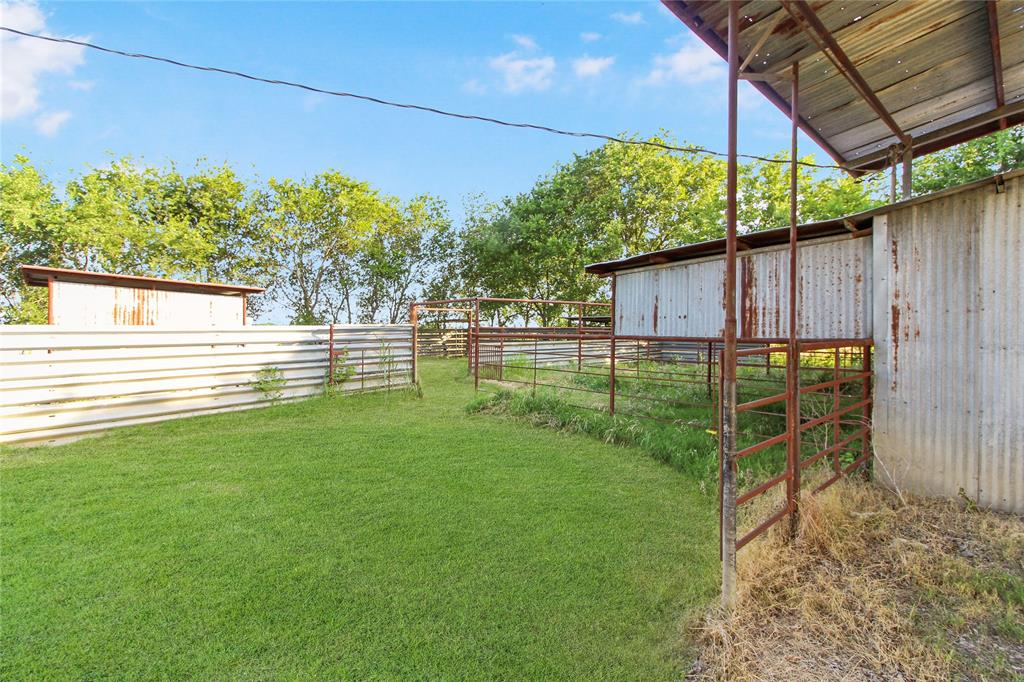 455 Hughes Cemetery Road Italy, TX 76651 - Photo 38 of 40 a view of a backyard with sitting area