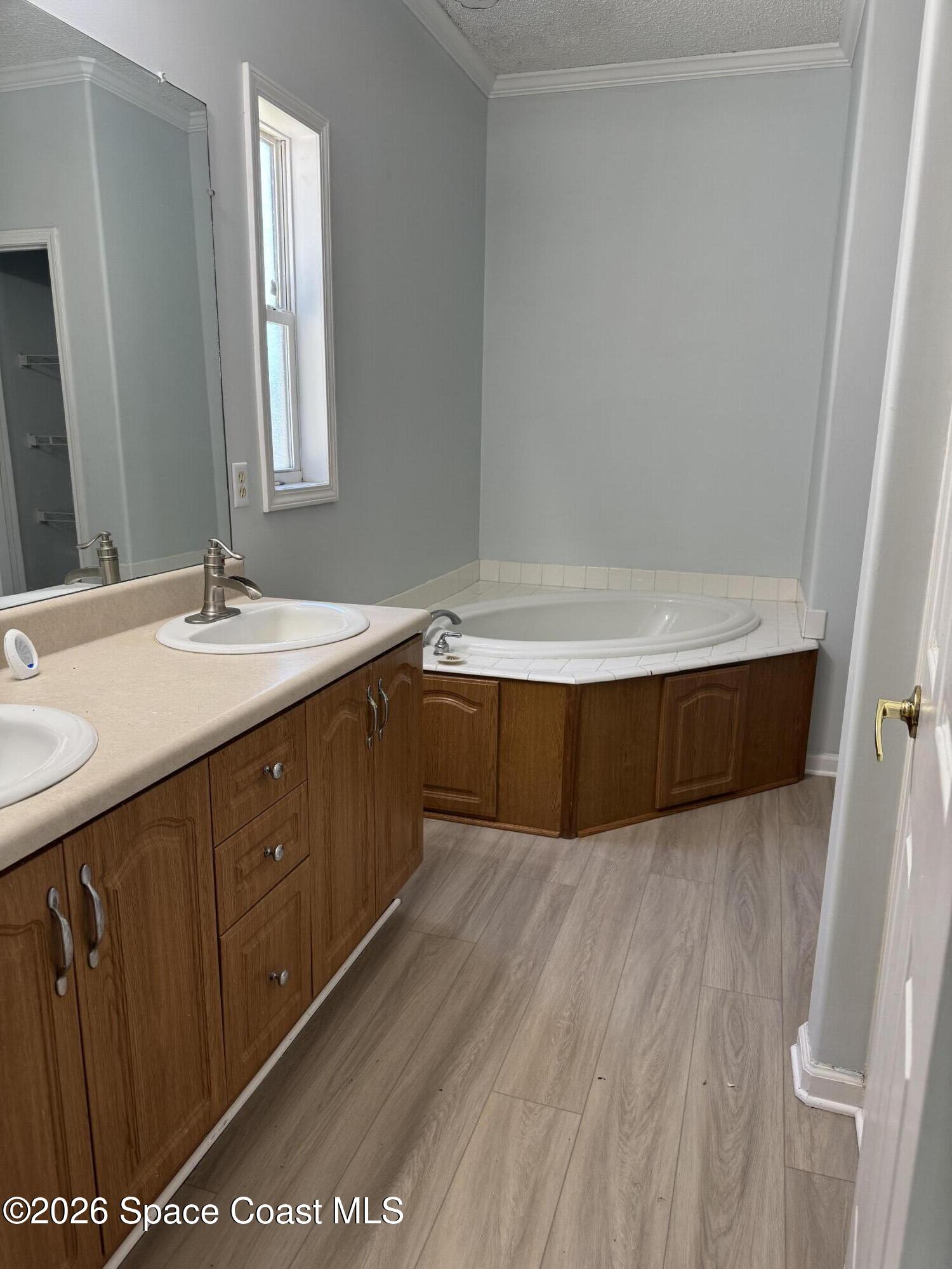 1130 Grapefruit Road Southeast Palm Bay, FL 32909 - Photo 9 of 14 a bathroom with a sink and a mirror