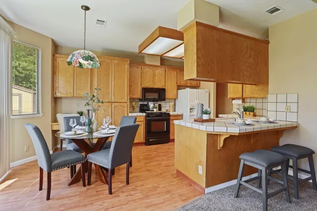 a kitchen with a sink stove and refrigerator