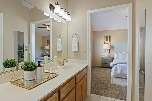 a white toilet sitting next to a shower