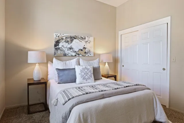 a bed room with a bed and a window