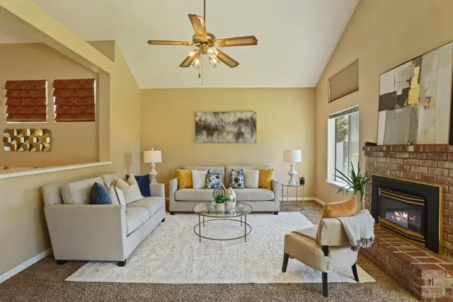a living room with furniture and a fireplace