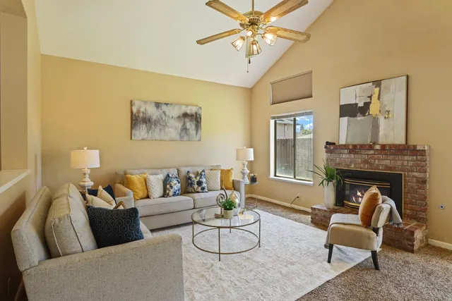 a living room with furniture and a fireplace