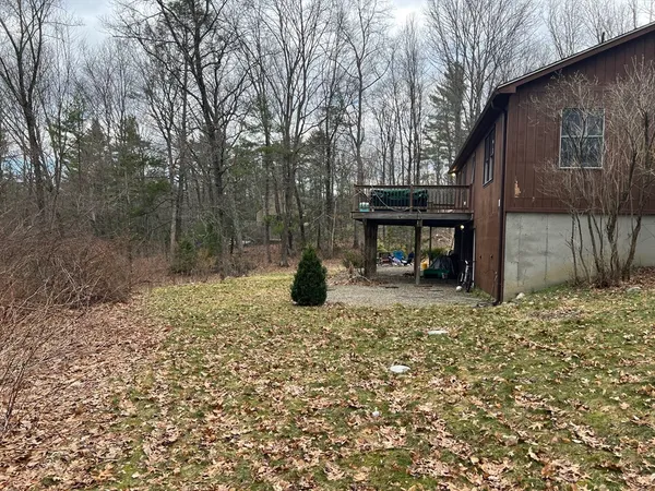 a view of a two chairs in a backyard