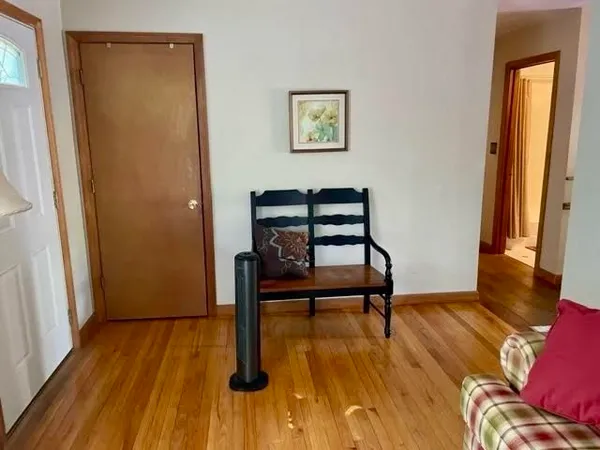 a view of a livingroom with furniture and wooden floor