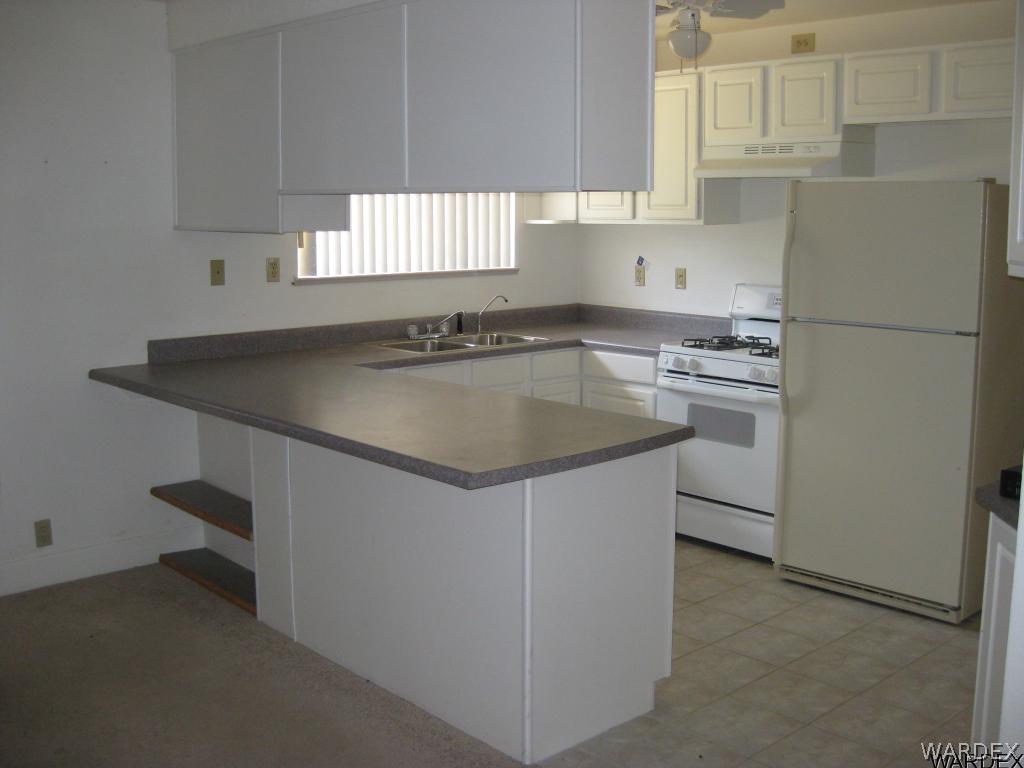 2676 South Dw Ranch Road Kingman, AZ 86401 - Photo 15 of 35 Kitchen breakfast bar