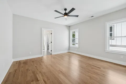 a view of an empty room and wooden floor