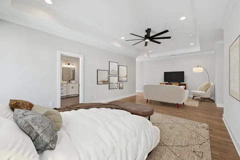 a spacious bathroom with a double vanity sink mirror and bathtub