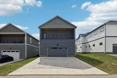 an aerial view of a house with a ocean view